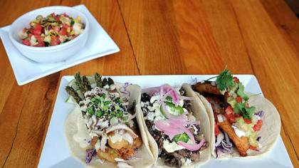 Asparagus tempura taco, skirt steak taco and the Santa Cruz-style fish taco with jicama salad prepared by executive chef Adam Manculich at Yo Rita on the South Side.