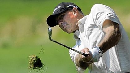 Tom Lehman takes a divot in the rough of the 11th hole during the Constellation Senior Players Championship at Fox Chapel Club.