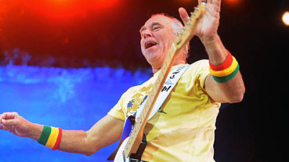 Jimmy Buffett arrives onstage Thursday.