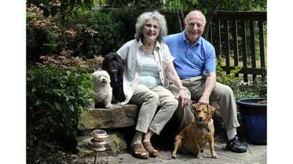 Jerry and Monica Segal with their dogs, Isabella (white), Sabrina (black) and Baby girlen of their Regent Square home.