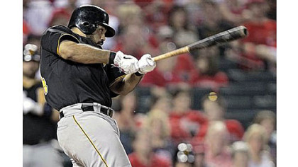 Pedro Alvarez hits a three-run double against the Cardinals in the fifth inning Friday in St. Louis.