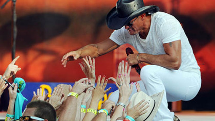 Tim McGraw reaches out to the crowd at Heinz Field, a stop on his Brothers of the Sun Tour with Kenny Chesney.