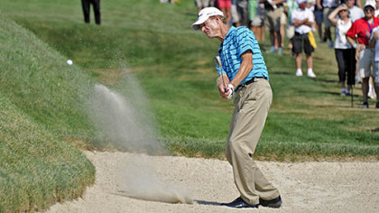 Joe Daley hits out of a bunker to the 17th green.