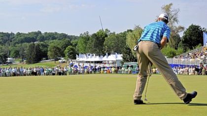 Joe Daley sinks a birdie putt on the 18th green to go 14 under and win the Constellation Senior Players Championship at Fox Chapel Golf Club Sunday.