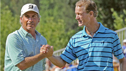 Joe Daley is congratulated by Fred Couples after sinking a birdie putt on the 18th green to go 14 under and win the Constellation Senior Players Championship at Fox Chapel Golf Club Sunday.