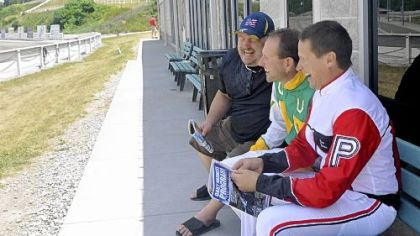 Dave Palone, right, shares a laugh with fellow driver Mike Wilder, center, and his friend Tim Caputo.