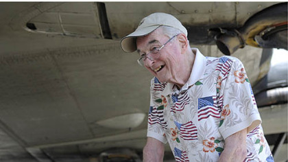 World War II veteran George Cahill, 86, who was a bombardier during the war, stands in front of the B-17.
