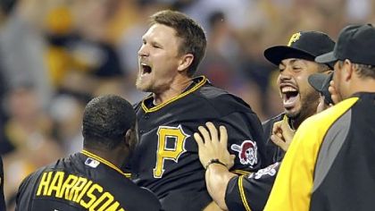 Drew Sutton is congratulated at home plate after hitting a walk-off home run against Houston in the ninth inning Tuesday night at PNC Park.