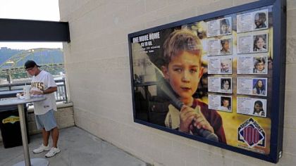 A sign hangs near the concourse at PNC Park displaying the foundation that works to find missing kids created by Dennis Bair, a Pleasant Hills resident and former minor league pitcher.