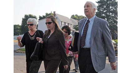 Jerry Sandusky arrives at the Centre County Courthouse with his wife, Dorothy (left) for the closing arguments in his trial today.