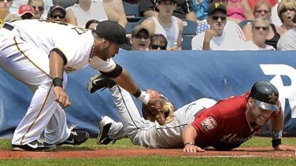 Third baseman Pedro Alvarez tags out Houston's J.D. Martinez, who got trapped off third, to help quell an Astros rally in the second inning Wednesday at PNC Park.