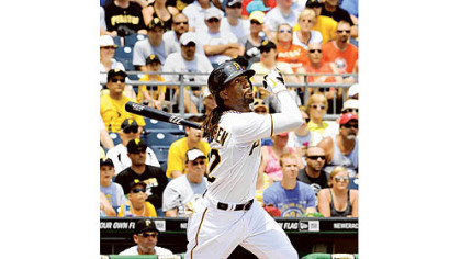 Andrew McCutchen hits a deep fly ball.