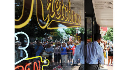 President Barack Obama enters Kretchmar Bakery on Third Street in Beaver.