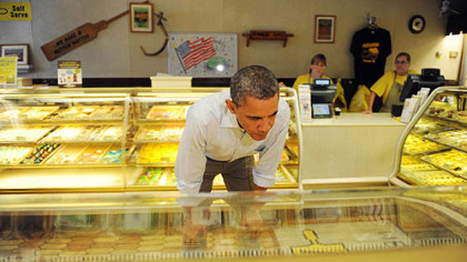 President Barack Obama looks over his options while stopping to buy pie and cookies at Kretchmar's Bakery on Third Street in Beaver today.