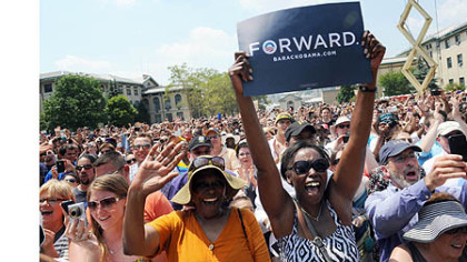 The audience cheer as President Barack Obama speaks at a campaign event at Carnegie Mellon University.