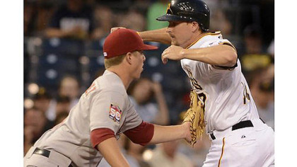 Astros third baseman Matt Dominguez tags out Drew Sutton to complete a rundown Thursday after pitcher Bud Norris nearly picked off Sutton at second in the fifth inning. The Pirates swept the series from the Astros with a 2-0 win.