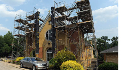 Scaffolding surrounds the bell towers of Saints Mary and Ann Catholic Church in Marianna.