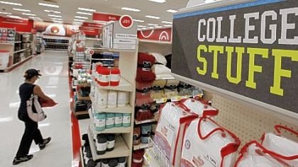 A shopper walks the aisles of a Target store on Thursday in Chicago. Shoppers, worried about jobs and the overall economy, pulled back on spending in June, resulting in tepid sales for many retailers. The results raise concerns about Americans' ability to spend during the back-to-school season, which is the second-biggest shopping period of the year and starts later this month.