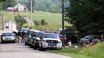 State Police, Mercyhurst University  forensic students and others at the edge of the woods on Gilchrist Road in North Union Township near Uniontown, searching for the remains of Jennifer Marteliz, 7, who disappeared in 1982.