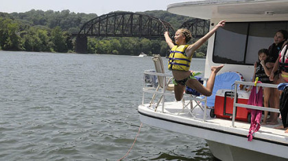 Alexa Bagaley, 12, of McCandless takes a plunge into the Allegheny River at the Aspinwall Marina to cool down.