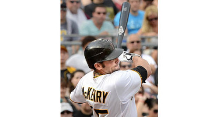 The Pirates' Michael McKenry hits a solo homer of the Giants' Ryan Vogelsong.