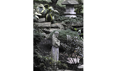 A statue of Saint Francis  graces the backyard are of the Polena's garden.