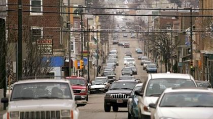 Cars move through downtown Hazleton, where a new city ordinance has caused members of its large Latino community to fear discrimination and to have concern for their future in the town.