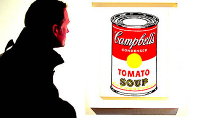 The origin of the idea for Andy Warhol's soup cans, like the "Campbell's Soup Can (Tomato)," has long been the subject of debate.