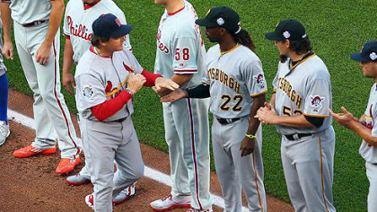 National League manager Tony La Russa is introduced as he shakes Andrew McCutchen's hand before the 83rd MLB All-Star Game at Kauffman Stadium in Kansas City, Missouri.