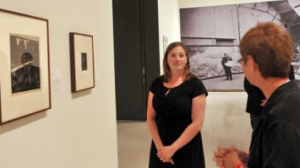 Alana Stieglitz Kanawalsky, a great-grandniece of the famed early 20th-century photographer Alfred Stieglitz, talks about her family as she stands in front of a portrait of Stieglitz right.