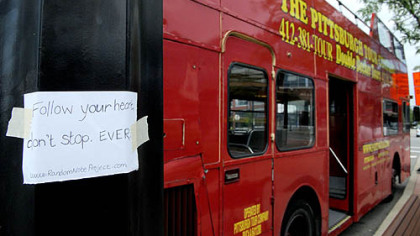 One of Gabrielle Bovard's notes is seen taped to a double decker bus at the South Side Works. Five years ago, Ms. Bovard, 25, began writing inspirational messages on notes and leaving them around Pittsburgh.
