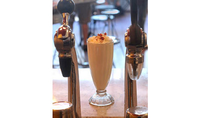 Applewood bacon milkshake served up in a traditional glass at The Milk Shake Factory.