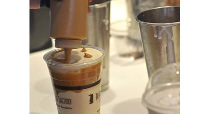 Peanut butter/cookie dough milkshake gets a peanut butter smiley face.