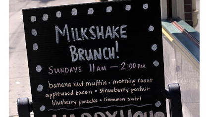 Sign in front of The Milk Shake Factory on Carson Street announcing milkshake brunch.