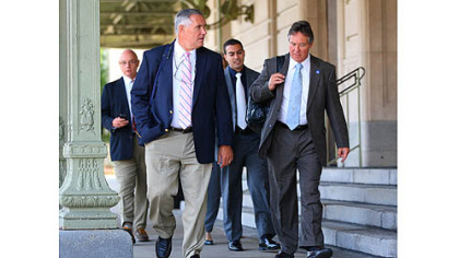 Members of the Penn State board of trustees, leave the Radisson Hotel in Scranton, after the Freeh report was released today.