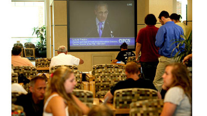 Penn State students watch the Freeh report press conference on a television in the HUB-Robeson Center on the campus of Penn State University.