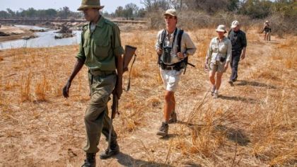 Along the river, it's single file for safety.