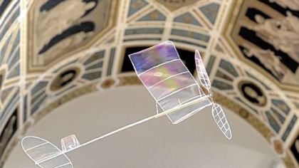 The plane weighs 1.2 grams and is made of microfilm and balsawood.