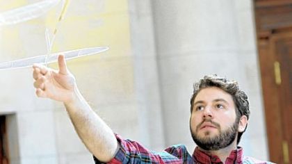 Ben Saks of CMU flies an ultralight plane at the Fine Arts Building.