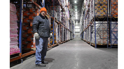 Dennis Nemanic, the inventory control manager at Great Lakes Cold Storage, stands in the coldest freezer room, which primarily stores ice cream at minus 15 degrees. He has been with the company for nine years.