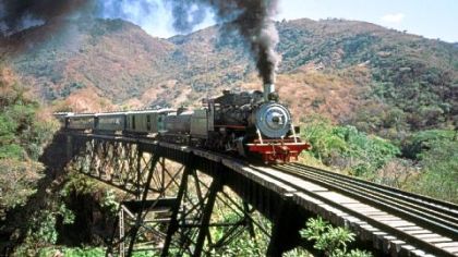 A steam train crosses the bridge below Agua Caliente, Guatemala. This steel structure was subsequently dismantled by scrap metal thieves after the declaration of "lesivo."