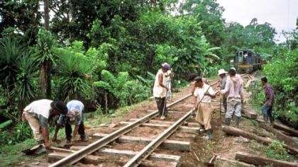 A track gang replaces ties near Puerto Barrios, Guatemala. In December 1999, commercial service was restored from Guatemala City, to the Atlantic ports of Puerto Barrios and Puerto Santo Tomas.