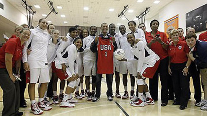 President Barack Obama, center, poses for a photo with members of Team USA women's Olympic basketball team in Washington, Monday, July 16, 2012. The team played Brazil in an exhibition basketball game, winning 99-67.