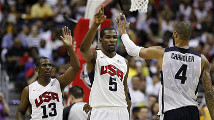 Team USA's Chris Paul (13), Kevin Durant (5), and Tyson Chandler (4) celebrate during the second half of a men's Olympic exhibition basketball game against Brazil, Monday, July 16, 2012, in Washington. USA won 80-69.