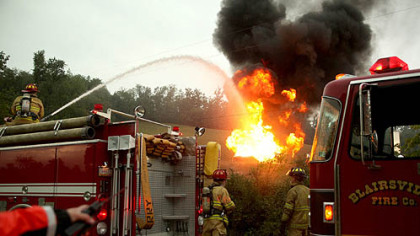 Blairsville firefighters respond to a natural gas well fire ignited by lightning in Derry during Wednesday's afternoon storms.