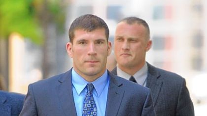 Pittsburgh police officers Michael Saldutte, left, and Richard Ewing arrive Tuesday at the U.S. District Court.