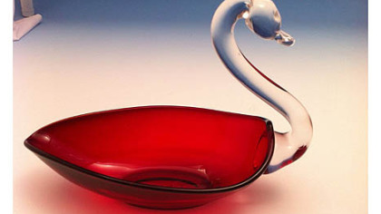 A ruby swan candy dish made by Duncan & Miller Glass Co. The company's museum in Washington, Pa., will hold a show, sale and auction of rare pieces at the Washington County Fairgrounds on Saturday and Sunday.