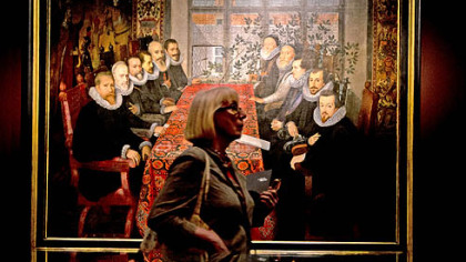A woman walks past a painting by an unknown artist from about 1604, entitled "The Somerset House Peace Conference" during the press view of the "Shakespeare: Staging the World" exhibition at the British Museum in London, Wednesday, July 18, 2012. The exhibition, part of the Cultural Olympiad , examines London as a world city 400 years ago through the perspective of Shakespeare's plays. It runs from July 19 to November 25.
