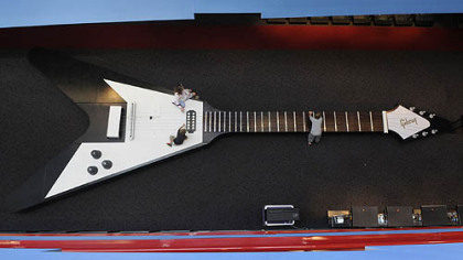 At 43.5 feet long, 16 feet wide and 2,255 pounds, the custom-made Gibson Flying V is the world's largest playable guitar. It is constructed of wood with strings made out of aircraft cable.
