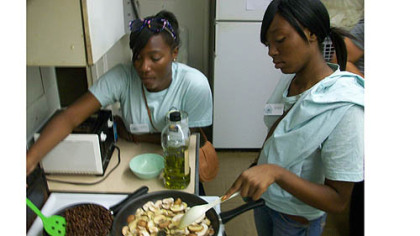 Phipps Conservatory and Botanical Gardens and Phipps Garden Center interns Lauryn Robinson, left, of Woodland Hills High School, and Denise Porter  of Westinghouse High School sautee black beans and mushrooms in olive oil and garlic at Phipps Garden Center.
